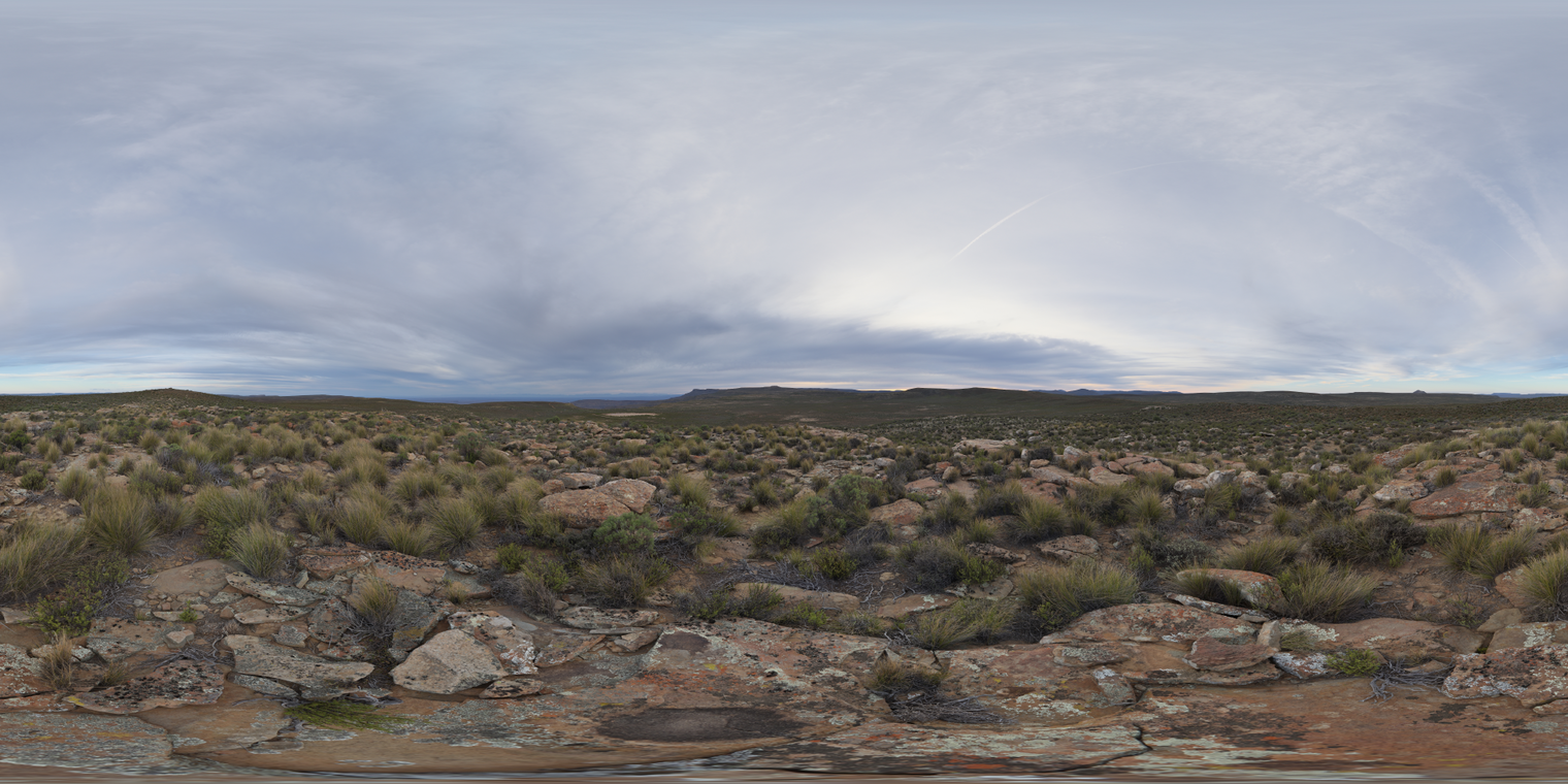 Unclipped, free 24K HDRI of rocky scrub plains at dusk under broad overcast clouds. Soft, cool ambient light with subtle horizon glow and soft shadows.