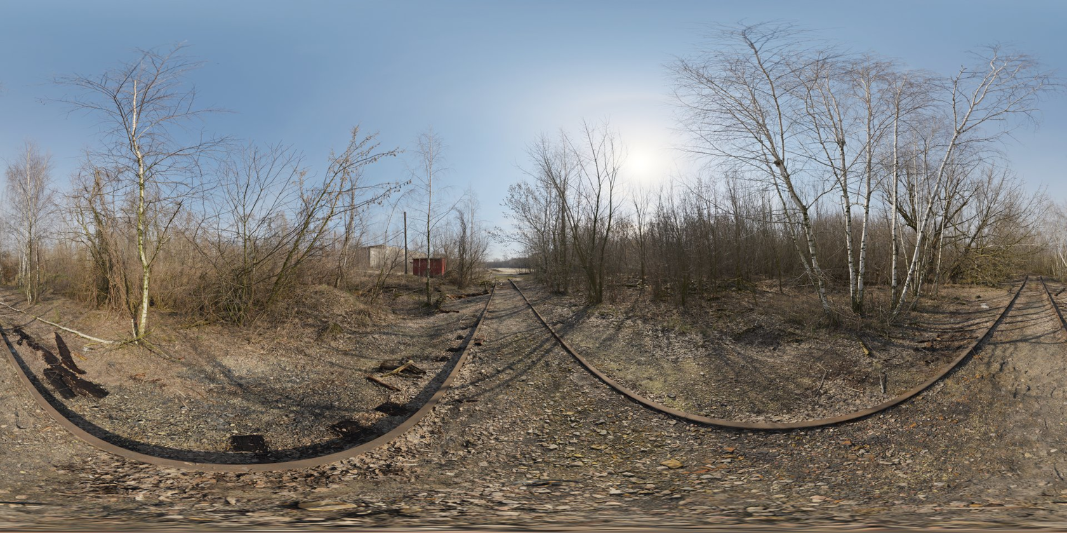Free 16K unclipped HDRI of an abandoned hopper terminal - low-angle winter sun, clear sky and high-contrast natural light, crisp shadows and cool birch reflections on rails.