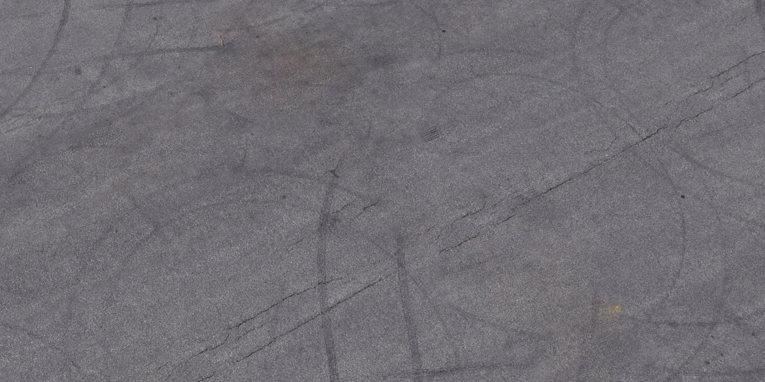 Free 8K asphalt texture of a flat, worn road with subtle cracks, faint tire marks and gritty surface - ideal for aerial, outdoor, road and floor scenes.