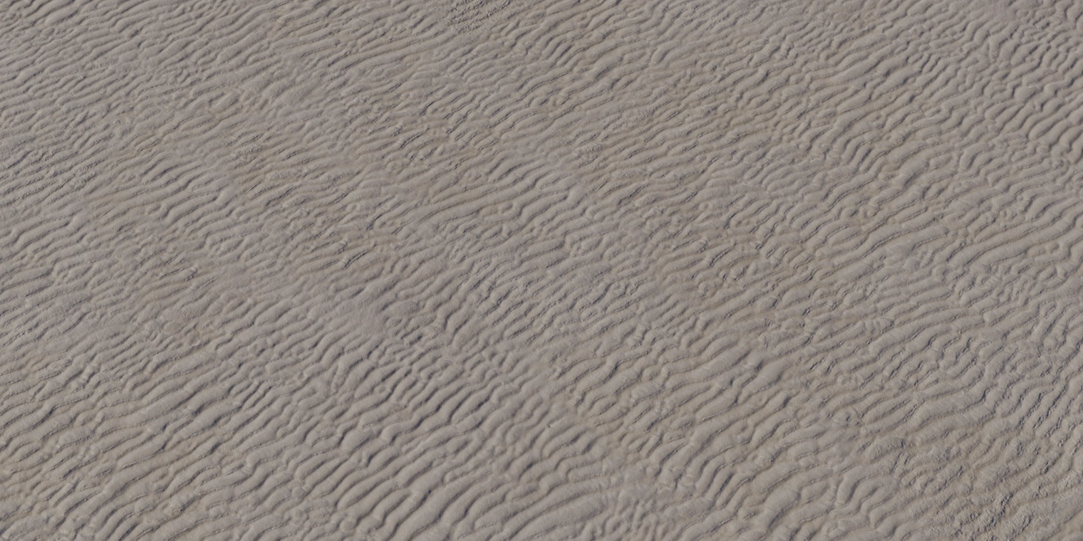 Free 8K texture of aerial beach sand with wavy, wind-sculpted ripples - fine-grained, low-gloss sandy surface ideal for coastal terrain and outdoor scenes.