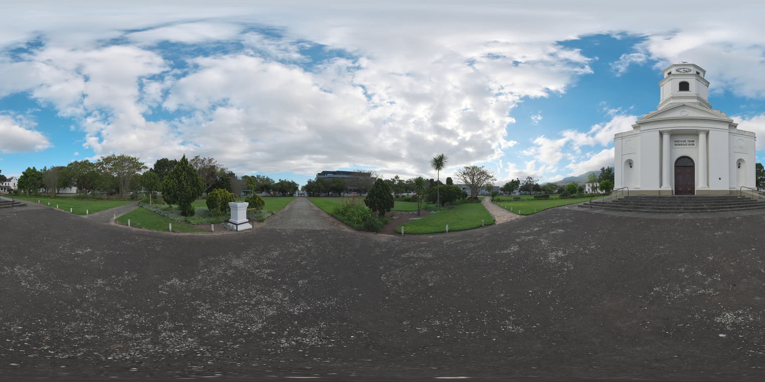 Free 20k unclipped HDRI, soft low-contrast morning/afternoon light over a white Dutch church, partly cloudy sky, asphalt foreground and green paved walkways.
