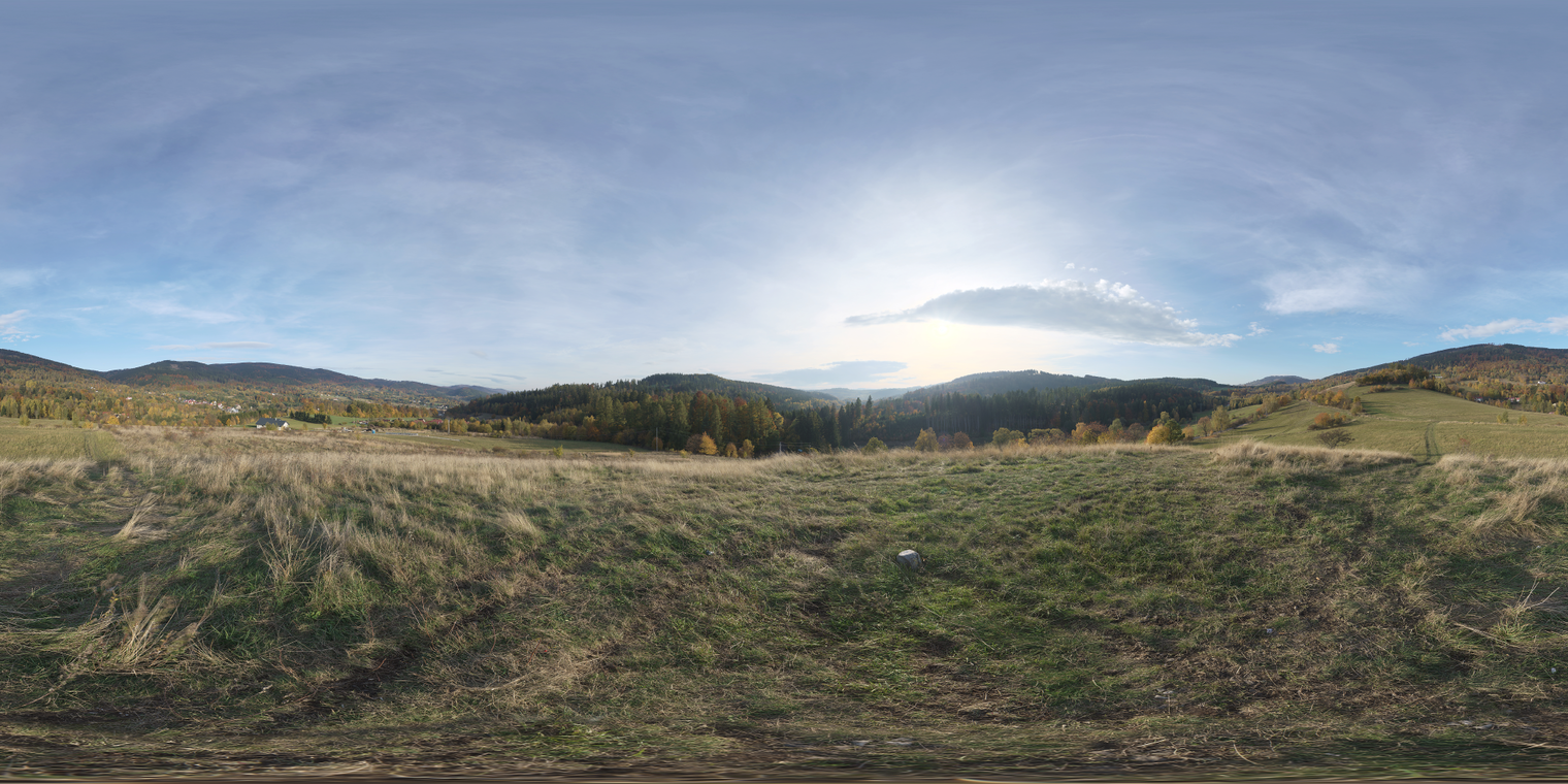 Free 29k unclipped HDRI: sunlit autumn hilltop vista with warm low sun, partly cloudy sky and high-contrast morning/afternoon light across fields and valley.