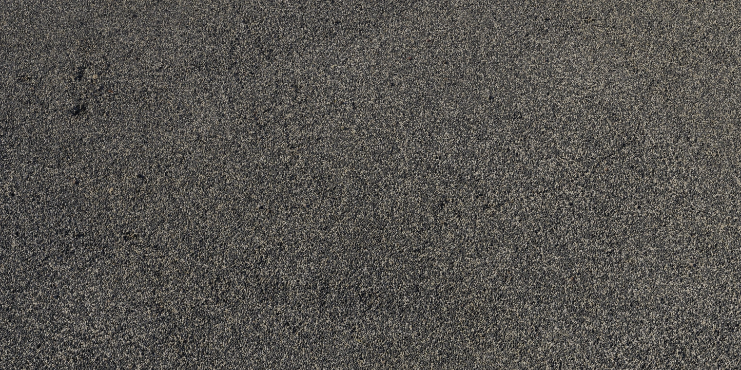 Free 8K texture, compact bicolour gravel of dark grey and beige pebbles, fine granular surface, tight packing, matte finish with subtle tonal variation.