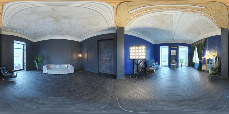 Unclipped, free 16K HDRI with cool midday studio lighting, mixing natural window light and artificial lamps to produce a medium-contrast, moody blue indoor ambiance.