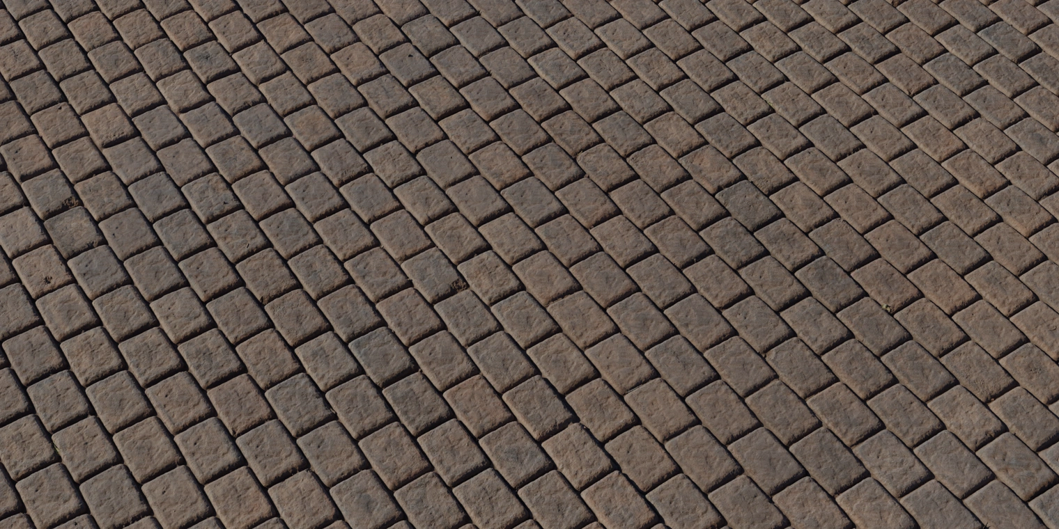 Free 8K texture: clean brown brick floor with rectangular stones, rough chiseled surface, deep mortar joints and subtle edge wear for realistic pavements.