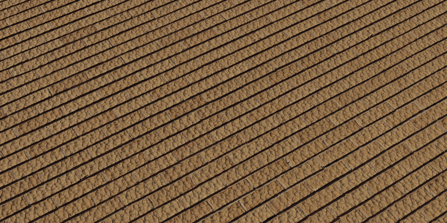 Free 8K texture of coarse, rough tan brick wall with narrow horizontal joints, chiseled block faces and subtle color variation for exterior masonry.
