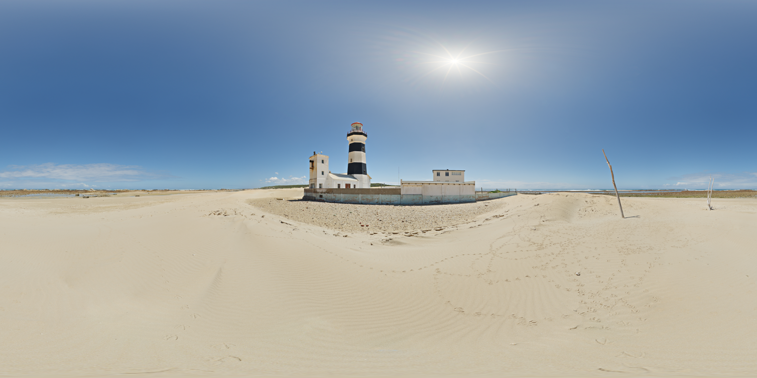 Unclipped, free 24K HDRI of bright coastal noon at a lighthouse, clear blue sky, sharp sun and hard shadows over pale sand dunes, slight horizon haze.