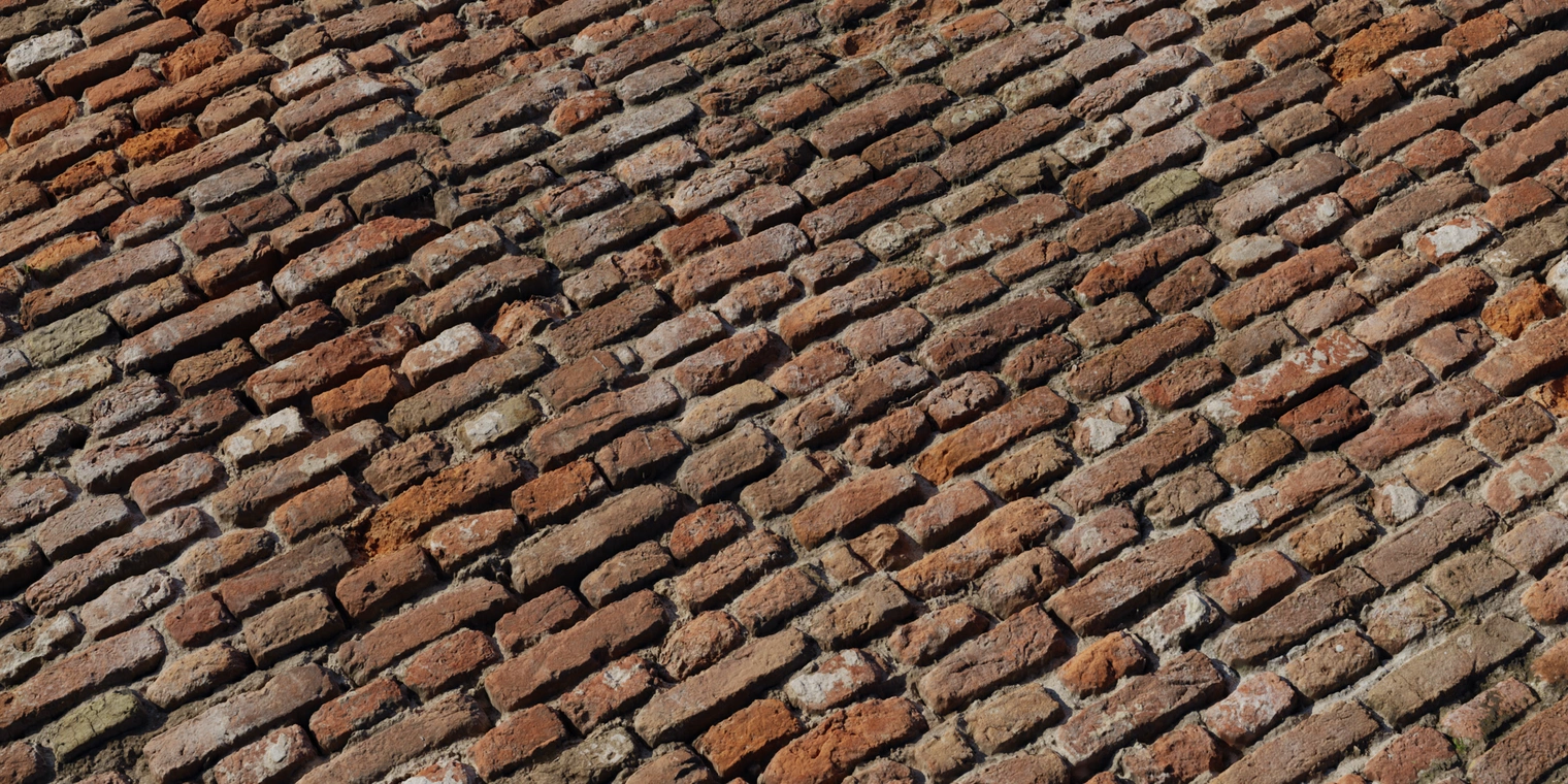 Free 8K texture of old red castle brick with rough, uneven surfaces, damp discoloration, weathered mortar and gritty, dirty detailing.