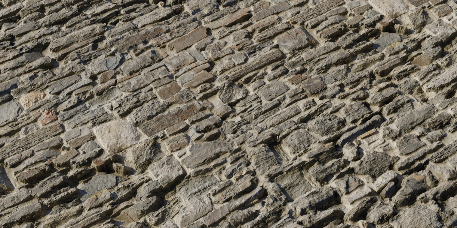 Free 8K texture of castle slate wall: stacked, weathered stone blocks with rough chiseled edges, mortar, beige-gray-brown colors and deep crevices.