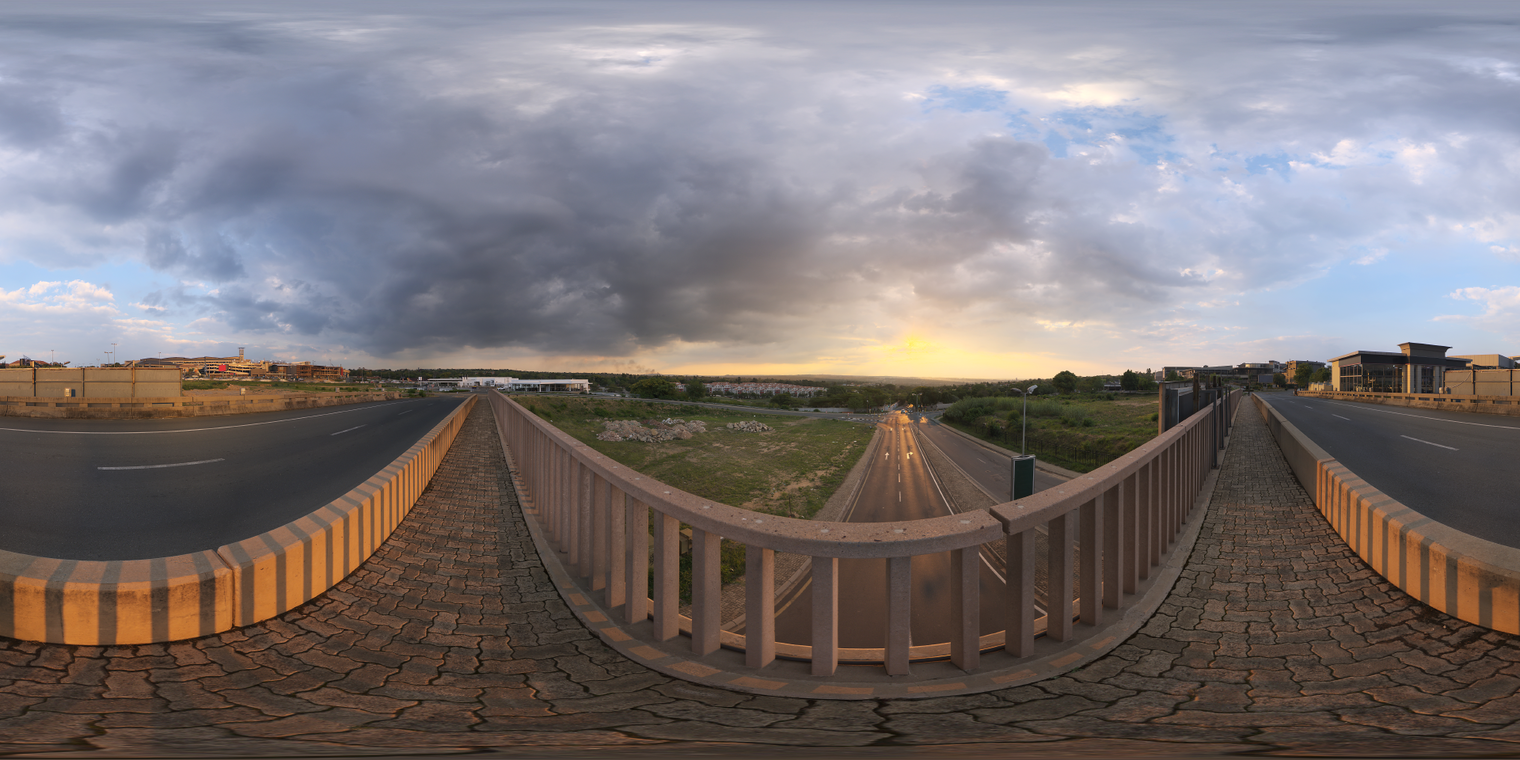 Free 24k, unclipped HDRI: sunset over a cedar bridge and road, warm low sun with dramatic partly-cloudy sky, medium-contrast urban golden-hour lighting.