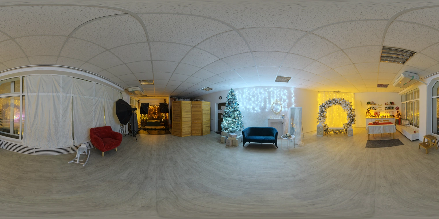 Free unclipped 16K HDRI of an indoor Christmas photo studio at night - mixed cool and warm artificial lights, medium contrast, festive couch and props.