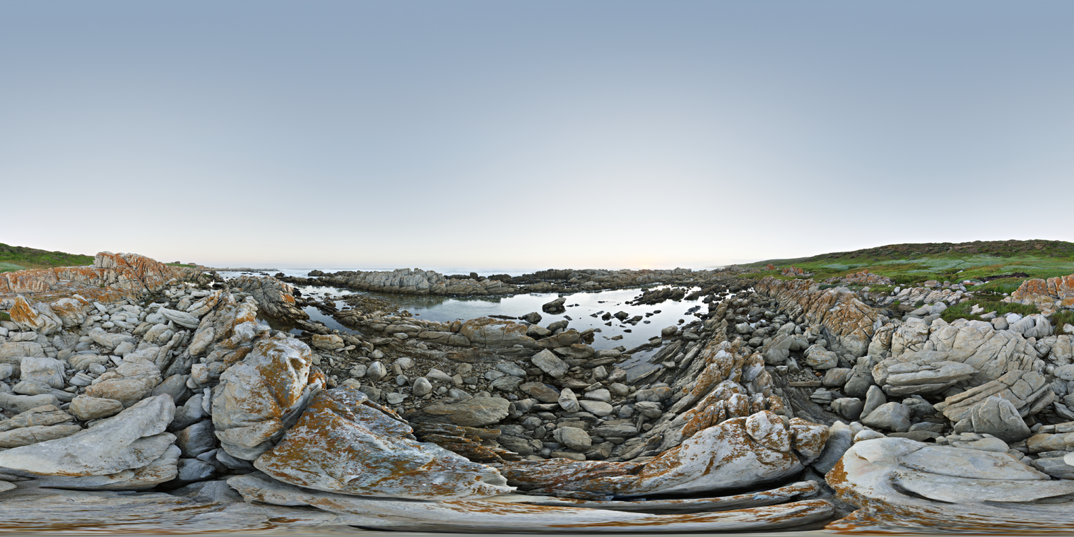 Unclipped, free 24K HDRI of rugged coastal rocks at blue-hour twilight; clear sky, soft cool skylight, faint warm horizon glow, calm pools, clean reflections.