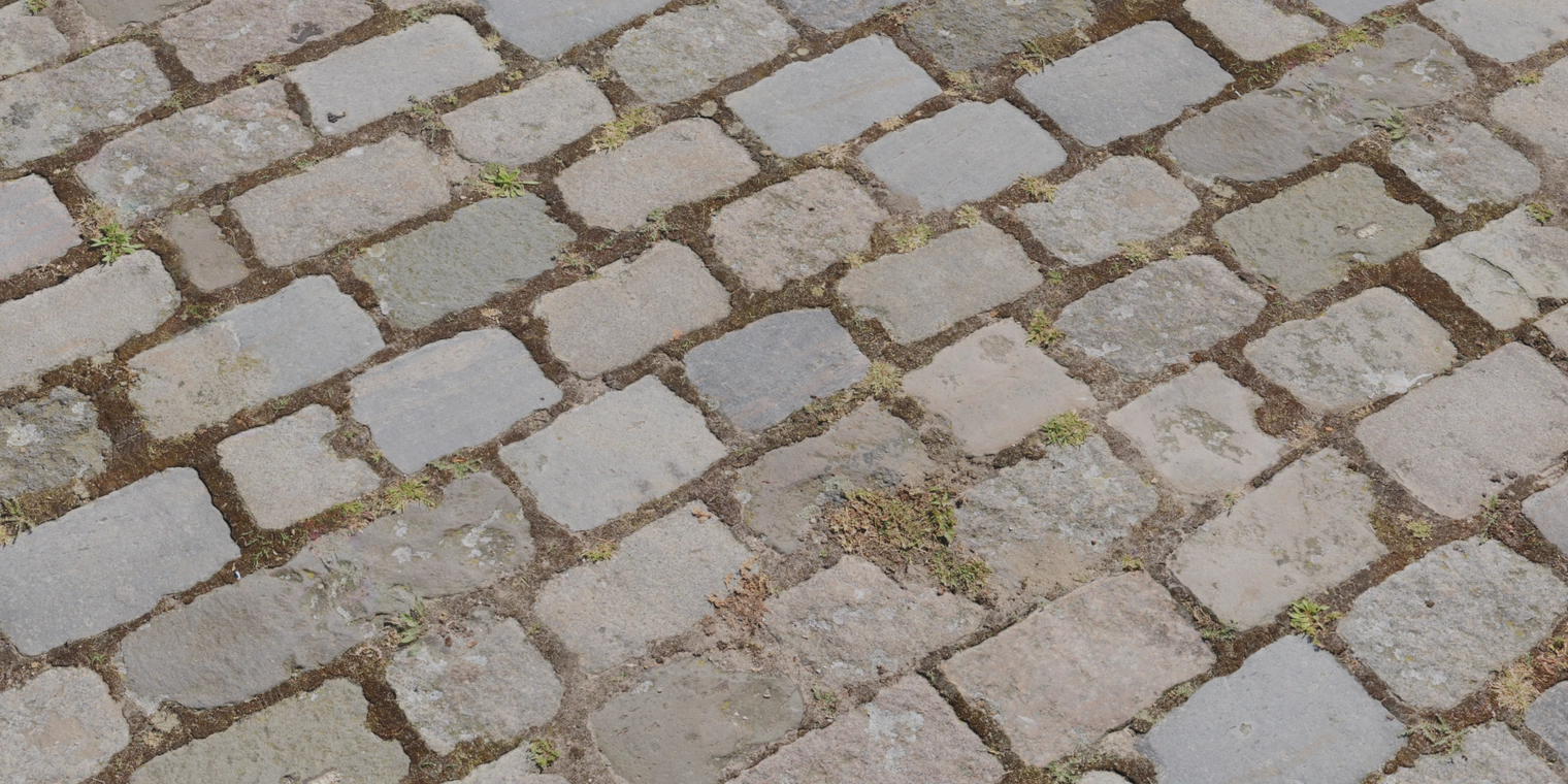 Free 8K texture of aged cobblestone pavement: weathered stone blocks, dirt-filled joints and moss tufts with varied, rough, slightly worn surfaces.