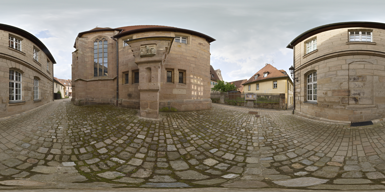 Unclipped, free 24K HDRI of an old-town cobblestone road. Warm stone buildings, overcast sky, soft low-contrast light, muted shadows, slight damp sheen.