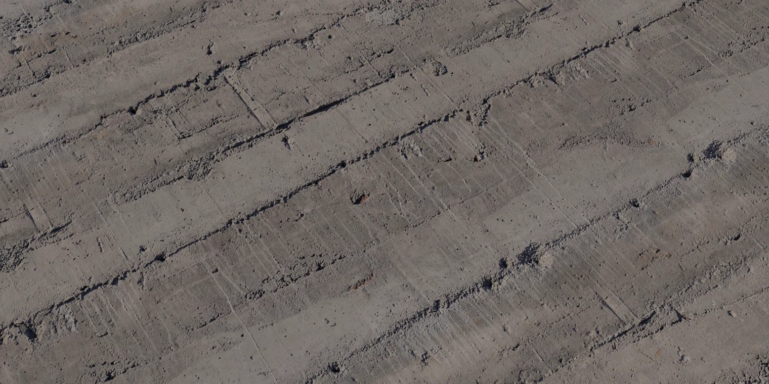 Free 16K texture of old, layered concrete with coarse formwork lines, chipped edges, fine cracks, scratches and subtle water stains.