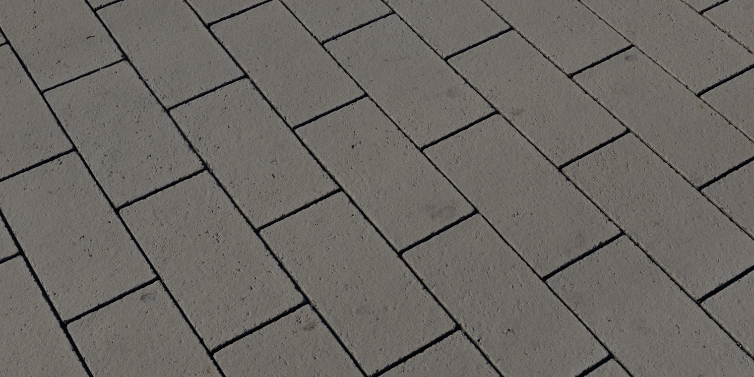 Free 8K texture: rough rectangular concrete tiles with narrow dark joints, subtle pitting and a matte, slightly weathered urban sidewalk finish.