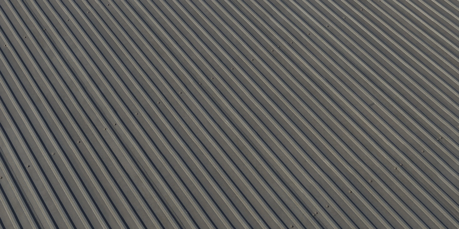 Free 16K texture of corrugated galvanized iron roofing - metallic sheet with pronounced ribs, subtle weathering, rivets and realistic metallic sheen.