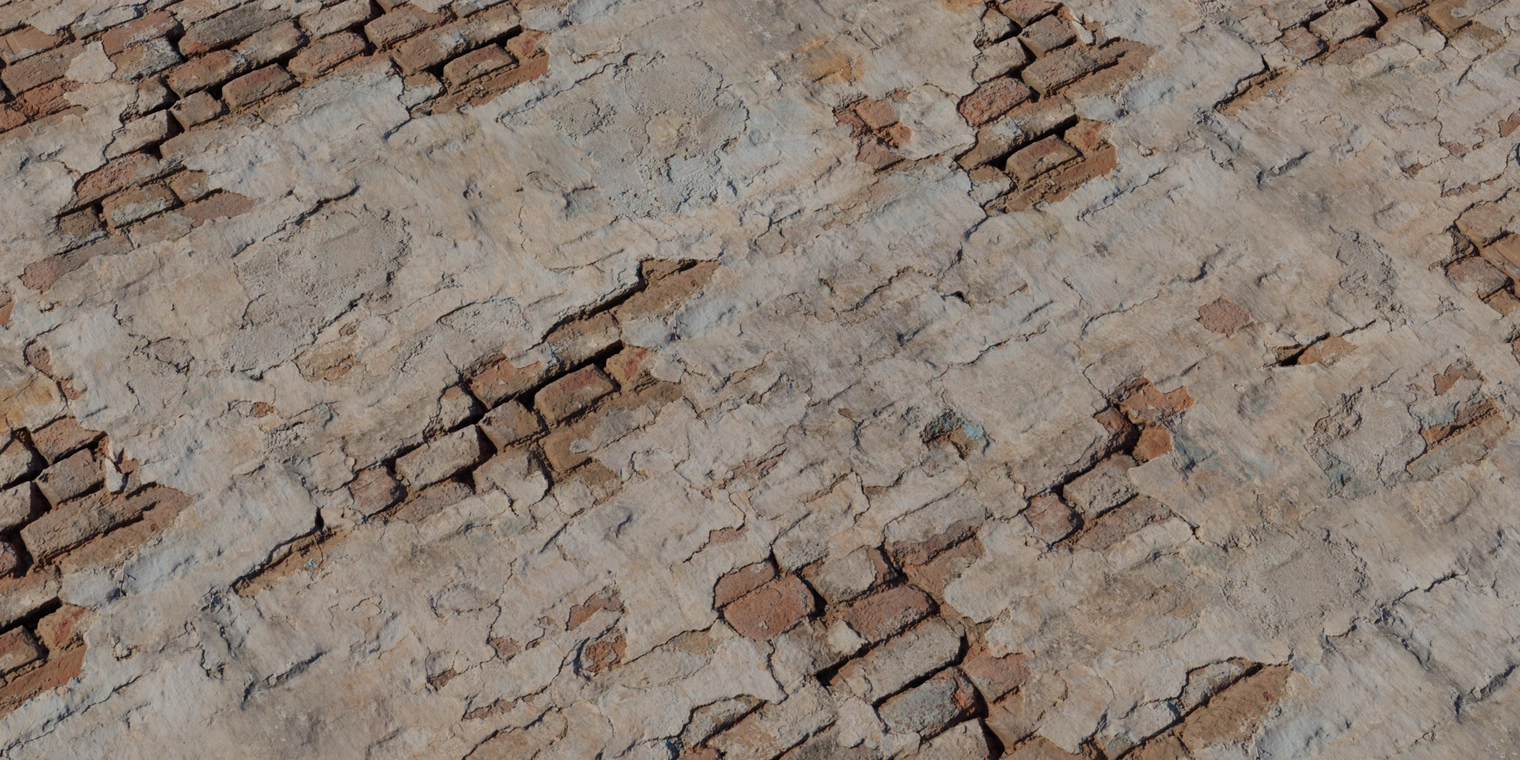 Free 16K texture of damaged plaster with exposed brick - weathered, cracked, chipped and crumbling surface for aged wall and masonry materials.