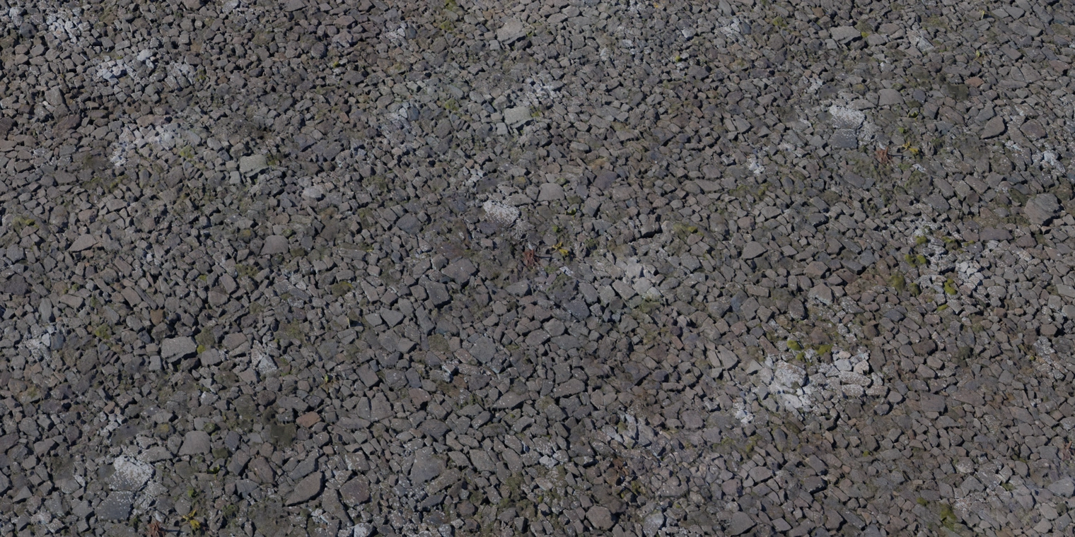 Free 8K texture of an aged fortress stone wall: rough, irregular cobbles with weathered edges, dark soiling, moss growth and deep crevices for a gritty, worn surface.