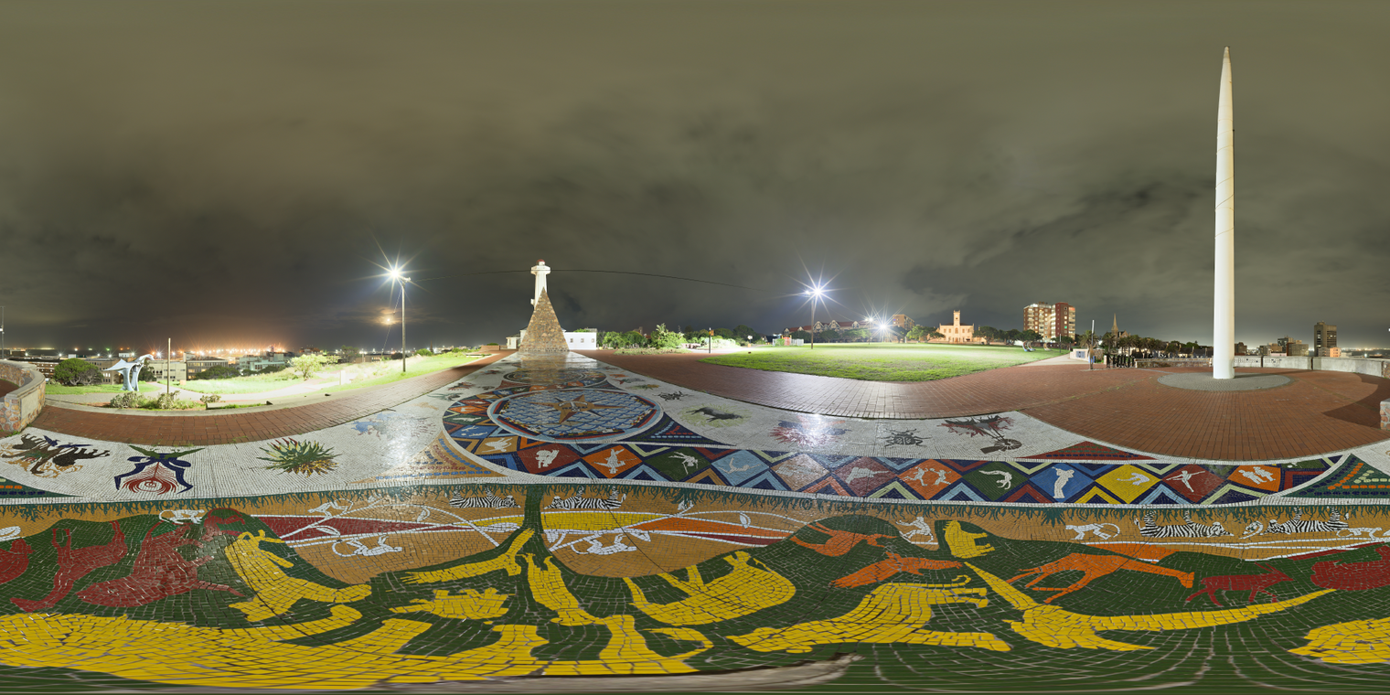 Unclipped, free 24K HDRI of Donkin Reserve at night: bright lamps, warm city glow, wet mosaic plaza, soft cloudy sky, vivid reflections, moderate contrast.