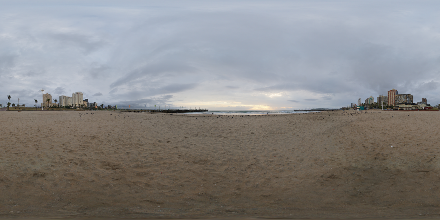Unclipped, free 24K HDRI of Durban North Beach at dawn: overcast sky, soft low-contrast light, cool tones with a warm horizon break, city skyline, calm surf.