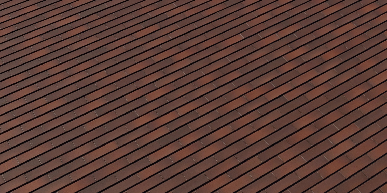 Free 8K red-brown exterior wall cladding texture with smooth, satin brick strips, tight horizontal joints and subtle color variation, crisp mortar lines.