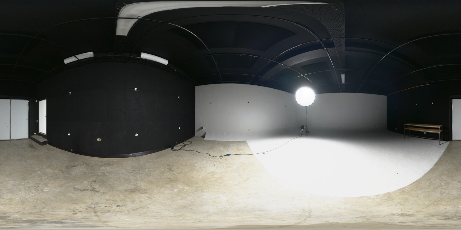 Free HDRI - high-contrast indoor studio with white cyclorama, dark ceiling and single umbrella lamp; crisp directional light and reflections for product and portrait renders.