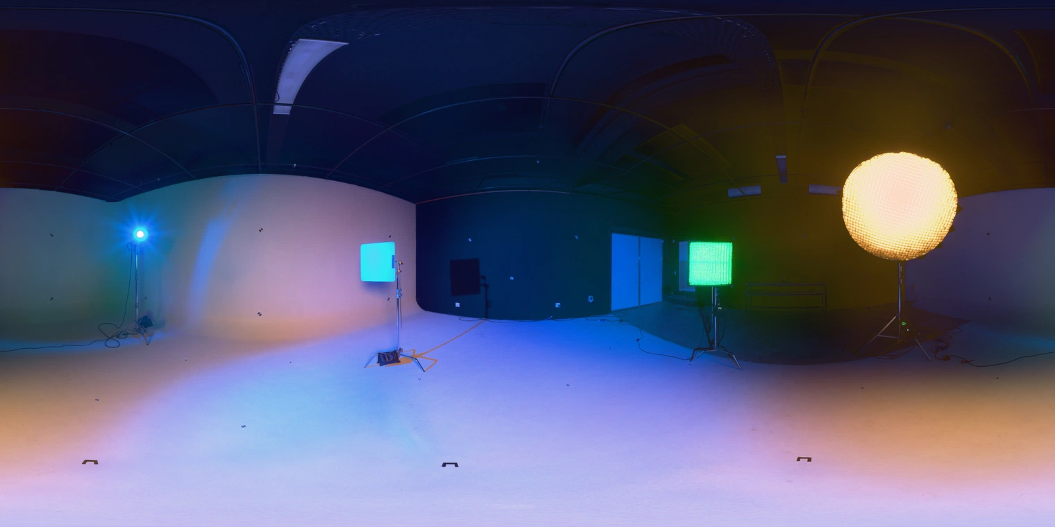 Free HDRI: Ferndale Studio 04 - indoor studio with warm yellow key lamp and teal/green accent lights, medium contrast; ideal for product, portrait, and lookdev.