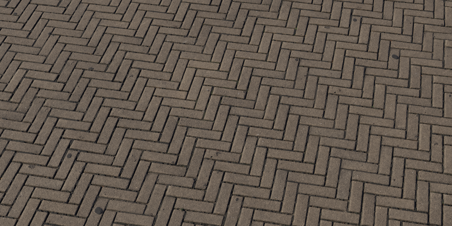 Free 8K texture: rough herringbone brick pavement with narrow interlocking bricks, worn edges, visible mortar joints and subtle surface dirt.