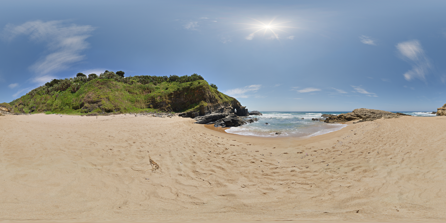 Unclipped, free 24K HDRI of a sunny beach cove with clear blue sky and rocky cliffs; crisp midday sun, hard shadows, sparkling waves, warm sand, breezy mood.