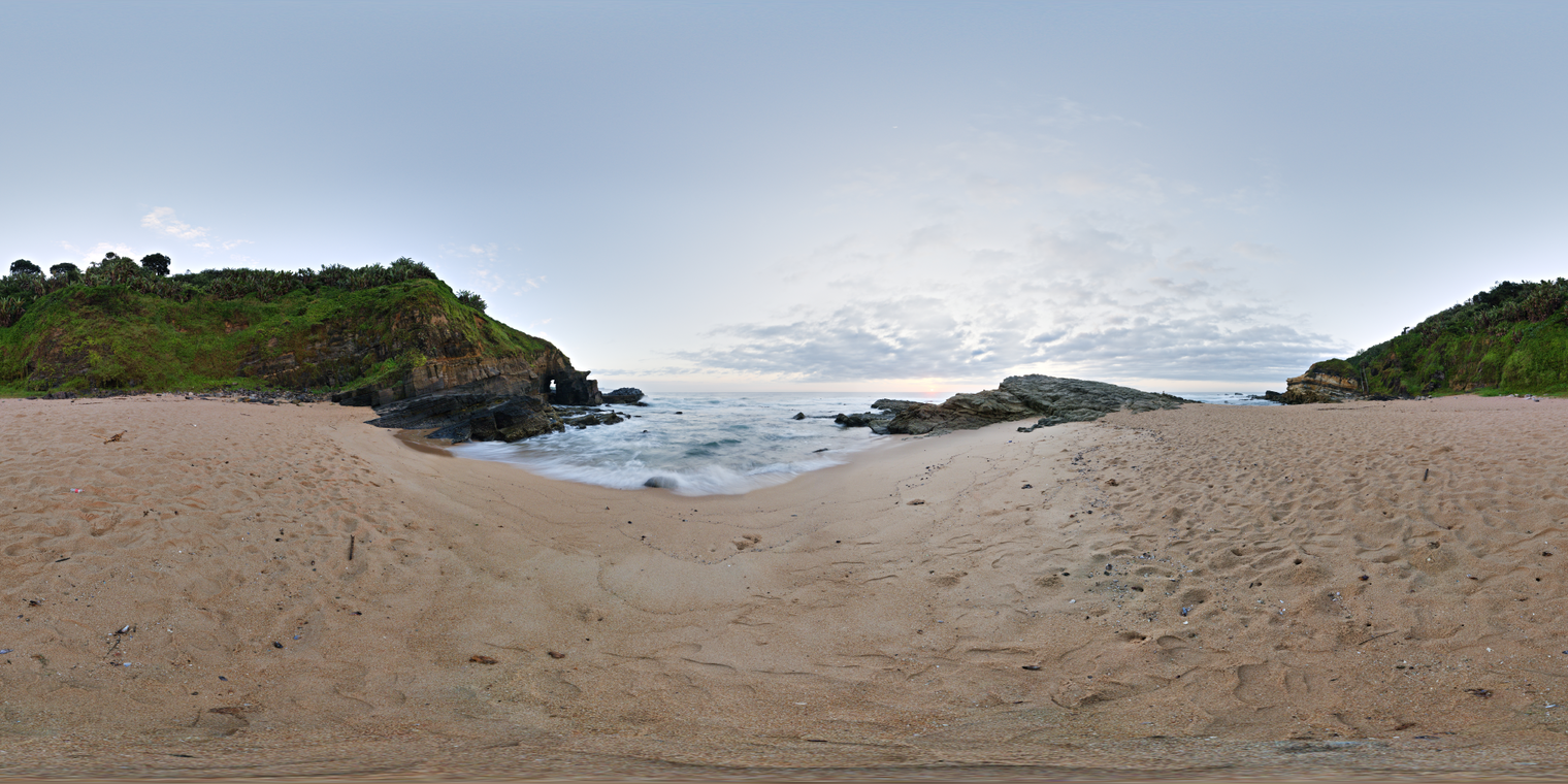 Free 24K unclipped HDRI of a rocky beach at sunrise: cool, soft dawn light, broken clouds, gentle waves and wet sand, subtle shadows.