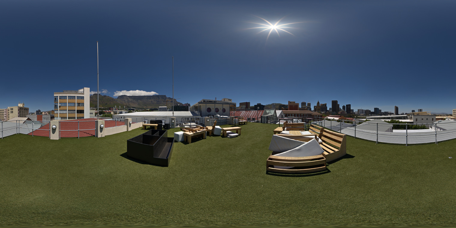 Unclipped, free 24K HDRI of a sunny rooftop with city skyline and distant mountains. Clear blue sky, sharp midday sun, crisp hard shadows, high contrast.