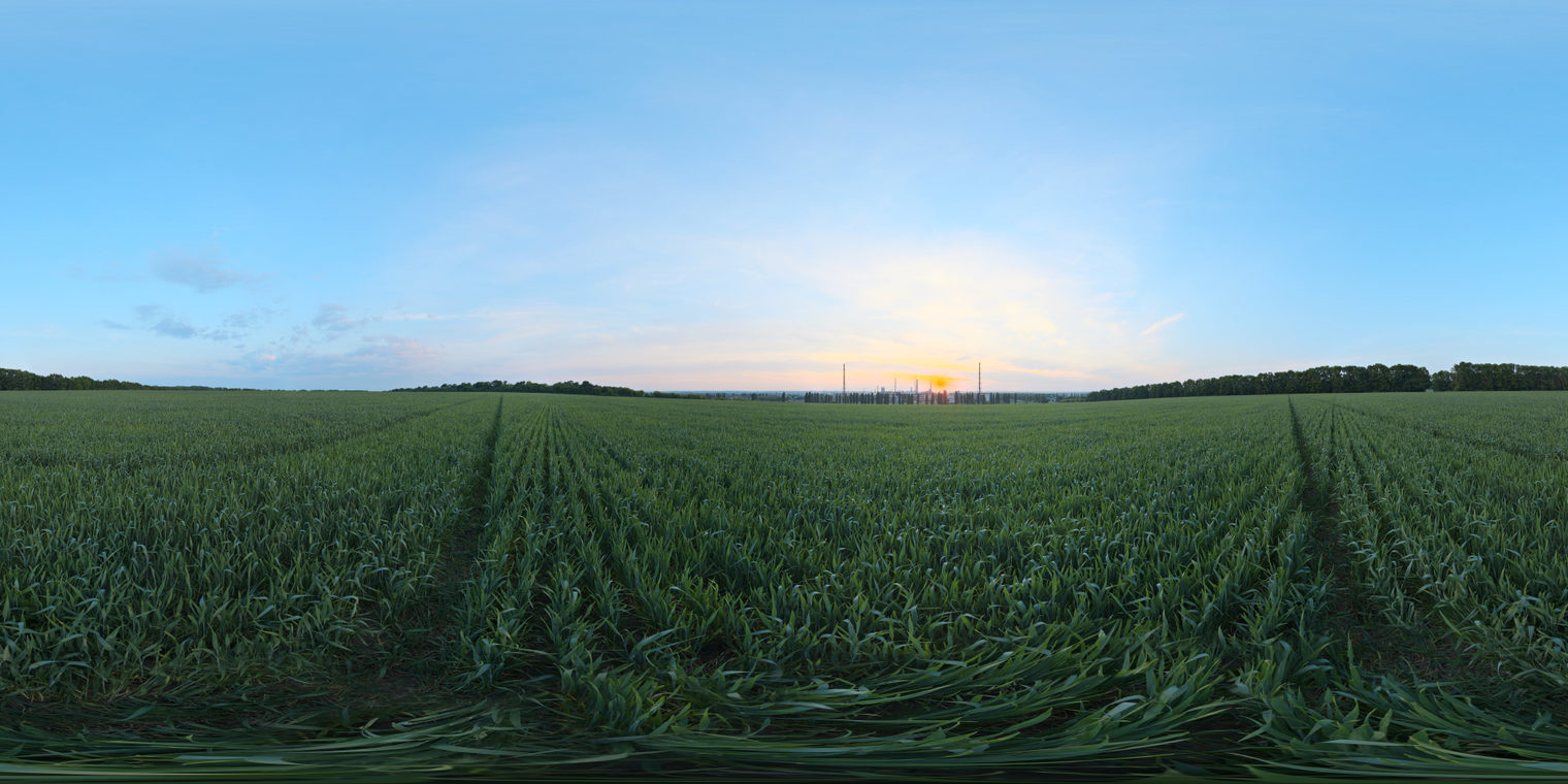 Free, unclipped 16K HDRI. Sunset over a green farm field with distant factory silhouettes - warm golden rim, cool blue sky, cloudy, medium contrast.