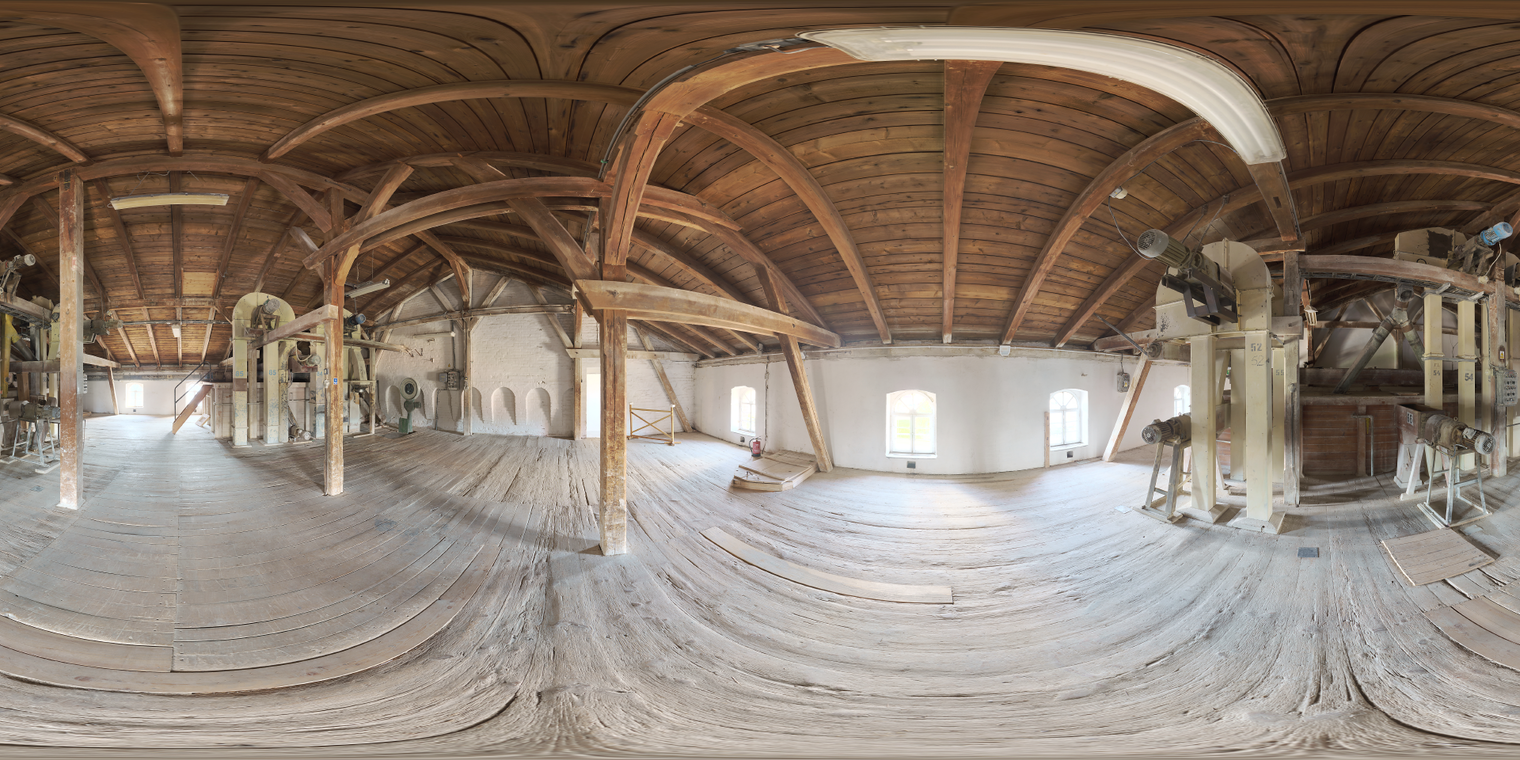 Free unclipped 29k HDRI of a sunlit industrial wooden attic: warm rafters, whitewashed walls, strong midday directional light and high-contrast shadows.