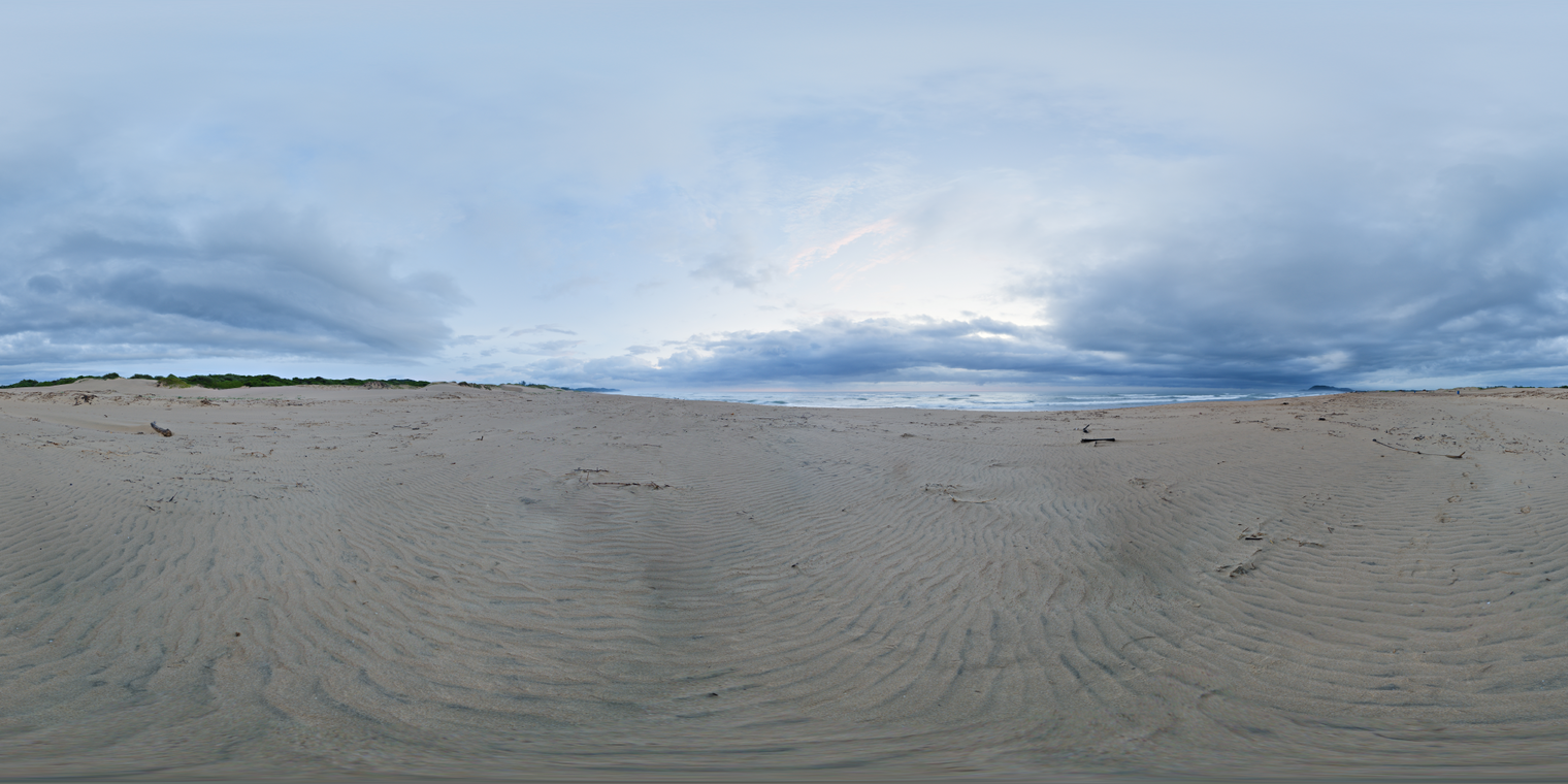 Unclipped, free 24K HDRI. Quiet dawn on beach with cool blue overcast sky, bright horizon glow, soft low-contrast light, rippled sand and distant surf.
