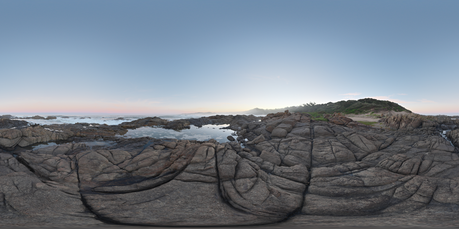 Unclipped, free 20K HDRI of rocky tidal pools at sunset: clear sky, soft pastel horizon, gentle sea spray and low-contrast, cool light with subtle warm rim.