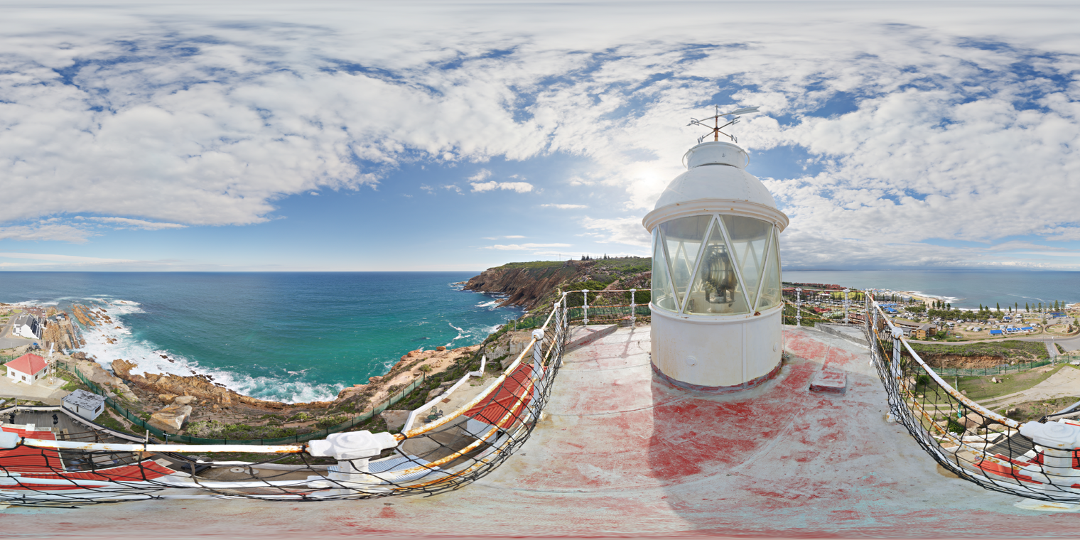 Free 24K unclipped HDRI of a lighthouse rooftop over a rocky coast, bright midday sun with scattered clouds, crisp shadows and cool sea reflections.