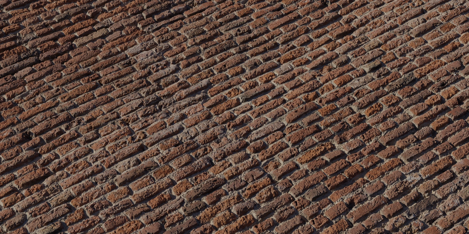 Free 16K texture of medieval red fired brick: rough, weathered bricks with chipped edges, deep mortar joints, varied red-brown tones and gritty surface detail.