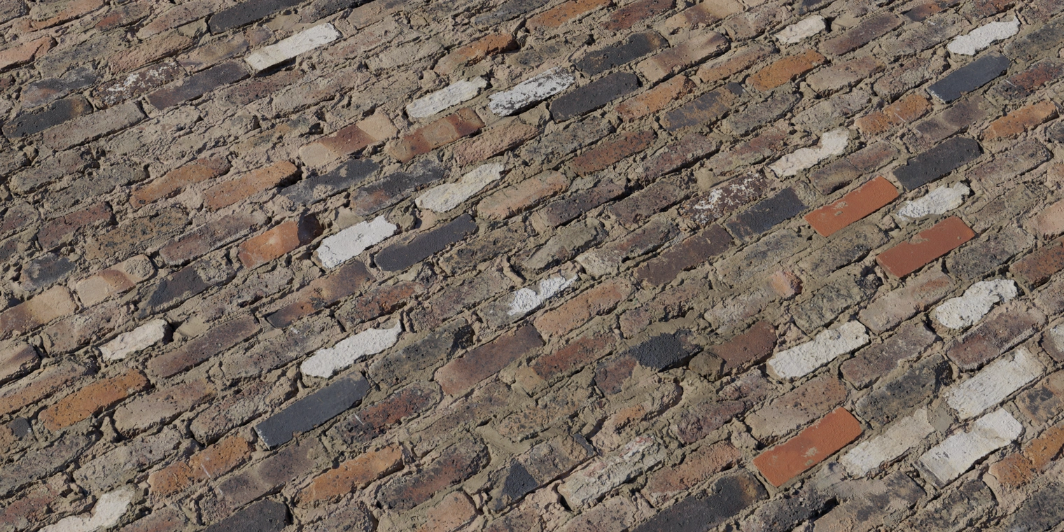 Free 8K texture of mixed, weathered brick wall with red, black and white bricks, rough mortar, chipped edges and gritty, worn-down surface.