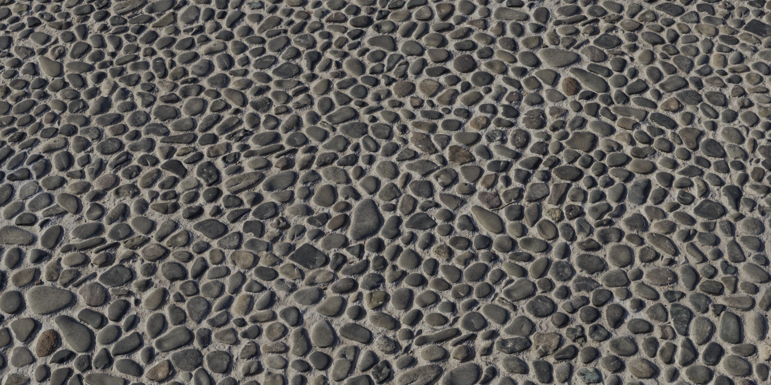 Free 8K pebble floor texture of multicolored rounded stones in cement, subtle gloss on stones, rough grout, natural gray/brown tones, strong relief.