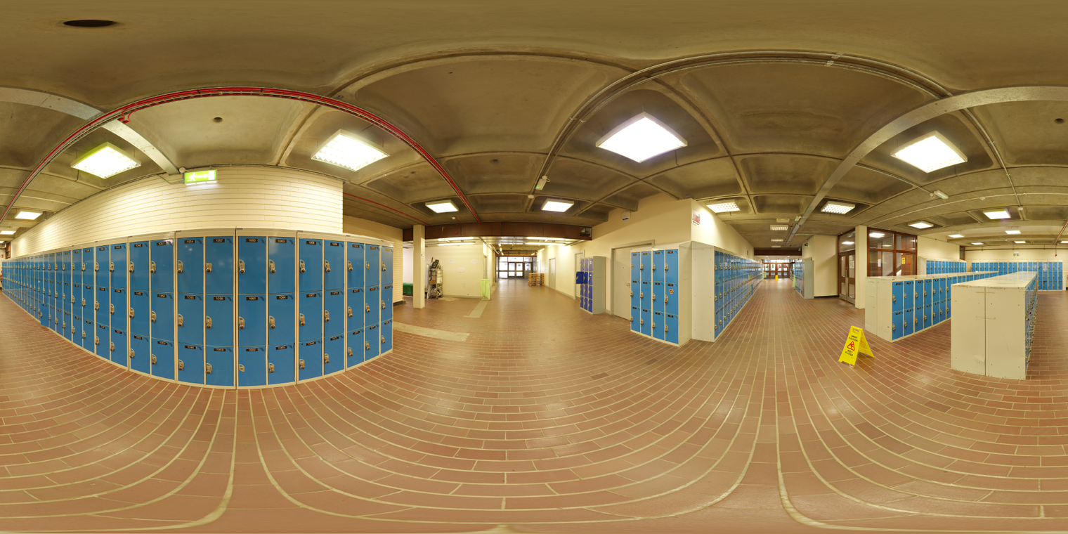 Free 20k unclipped HDRI: fluorescent locker room, warm yellow cast, soft even light, low contrast, clear specular highlights on tiled floor and blue lockers.
