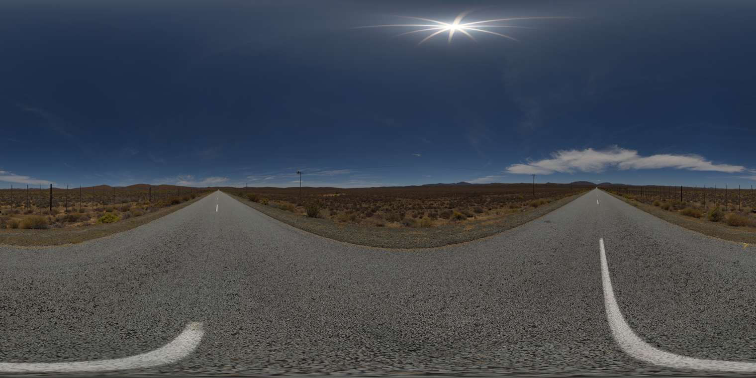 Unclipped, free 24K HDRI of a lonely desert highway under a clear deep-blue sky; hard midday sun, sharp shadows, pale asphalt, low brush and distant ridges.