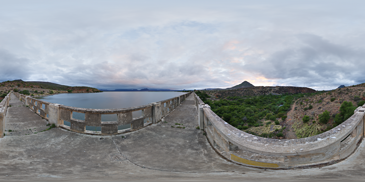 Free, unclipped 24K HDRI of a weathered concrete bridge at sunrise: mostly overcast, with subtle sunlit cloud highlights.
