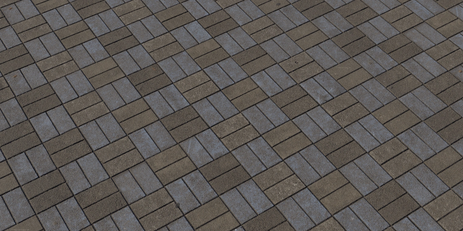 Free 8K texture of patterned stone pavers - interlocking rectangular bricks in muted gray-blue and brown tones with roughness, grout lines, and light wear.