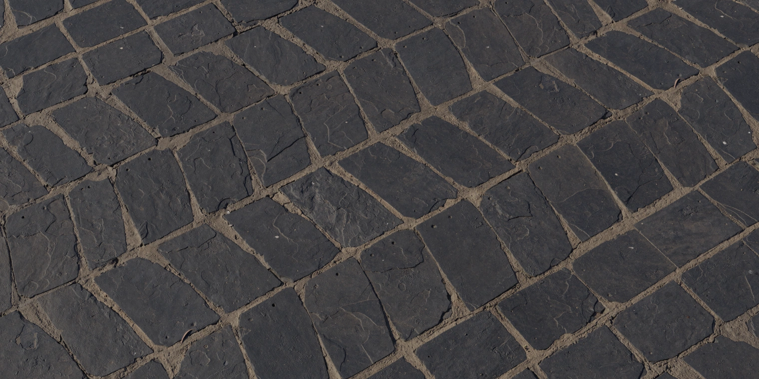 Free 8K texture of patterned, weathered slate tiles: dark, rough stone slabs with irregular edges, worn cracks, gritty mortar joints and a low, natural surface sheen.