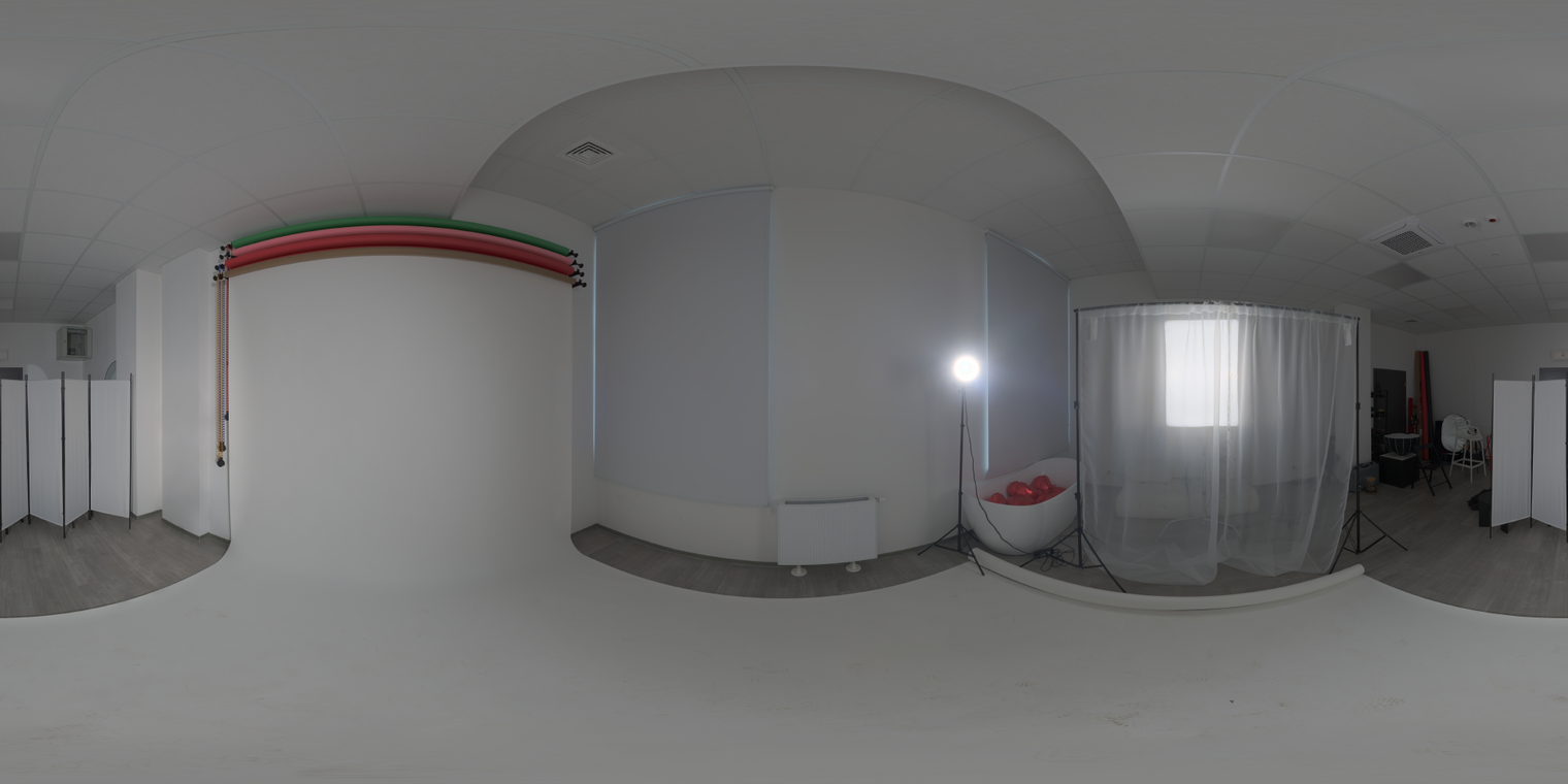 Free, unclipped 20K HDRI - indoor studio with white cyclorama, high-contrast key lamp and soft window diffusion; ideal for product, portrait and lookdev lighting.