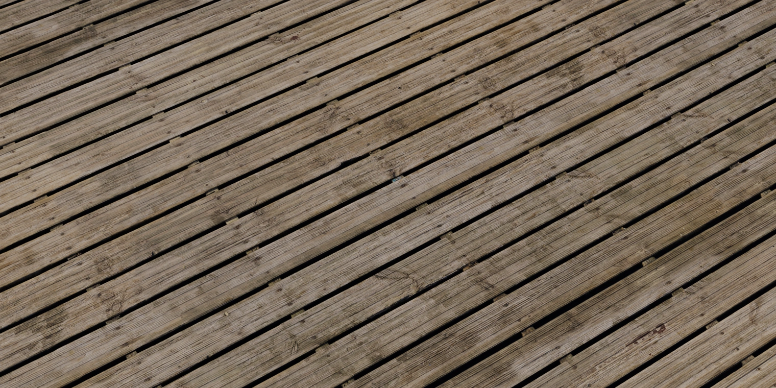 Free 16K texture of weathered wooden planks: rough, worn cabin flooring with scratches, discoloration, knots and deep grain for exterior timber.