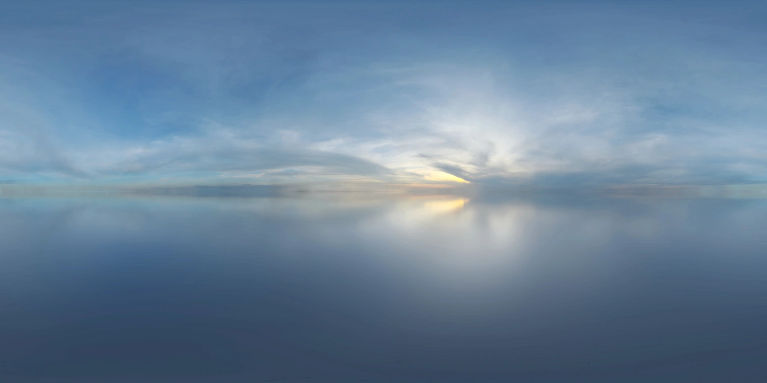 Free 16K HDRI, unclipped: soft, low-contrast sunrise with partly cloudy blue skies and a warm horizon glow, giving cool ambient light and subtle reflections.