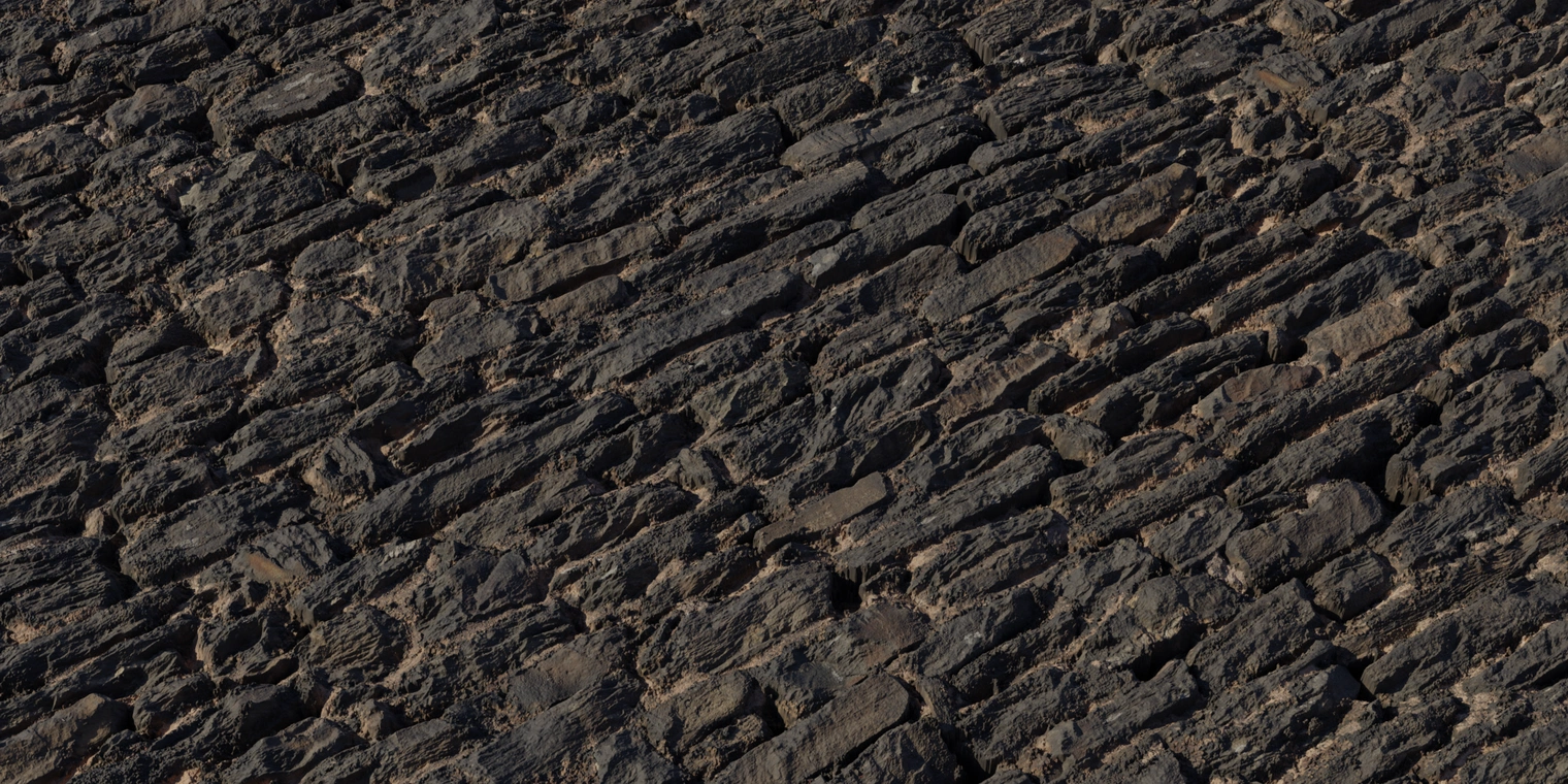 Free 16K texture of weathered, crumbling stone fortress walls with chipped, rugged rock layers, deep mortar crevices and a dark, timeworn surface.