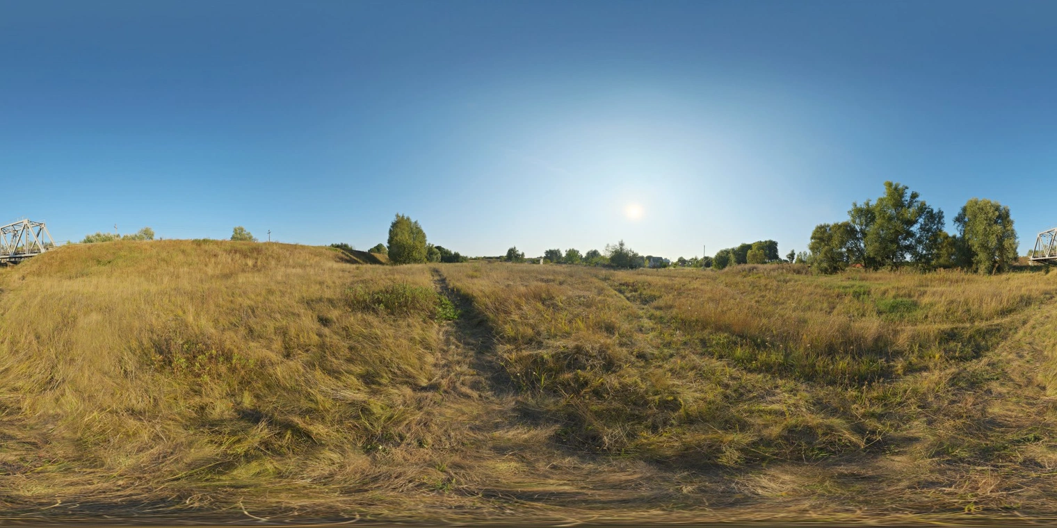 Free 16K HDRI, unclipped. Bright, clear late-day sun over a dry grassy field with warm golden tones, strong directional light, crisp shadows and high contrast.
